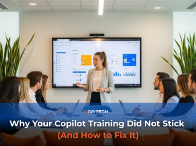 A trainer stands at the front of a modern meeting room presenting Microsoft 365 Copilot features on a large screen while a team of employees sits around the table learning how to use the tool during a workplace training session.